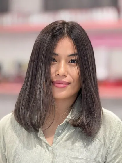 A front view of this ash-colored bob. The cut is clean and modern, and the color gives it a sophisticated edge.
