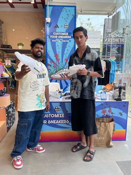 One of our artists with a customer at the Adidas Linking Road event. We love connecting with fellow sneakerheads and bringing their custom ideas to life.