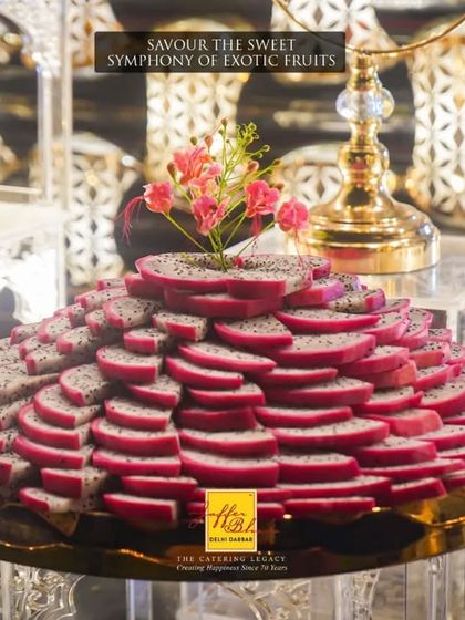 Savour the sweet symphony of exotic fruits. A stunning, layered presentation of sliced dragon fruit, showcasing our commitment to artistic and appealing food displays.