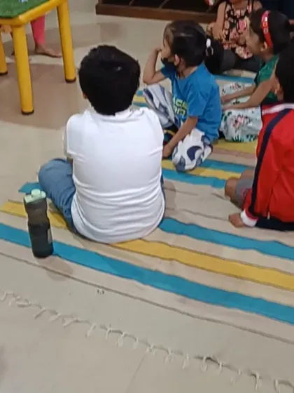 A young listener watches intently, captivated by the classic story being told.