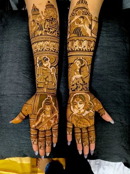 A very detailed design featuring multiple figures, including the bride, groom, and deities, telling a story of love and blessings.