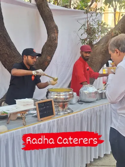 A guest enjoying a warm bowl of soup from our counter at a garden party. It's a perfect starter for an evening event.