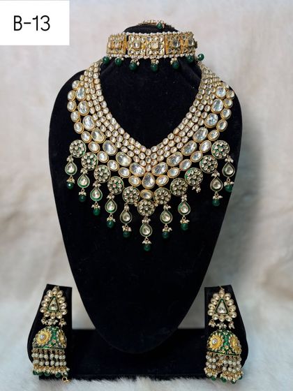 This is my long and short bilandi set, B-13. The cascading design of the choker and the matching jhumkas create a full and luxurious effect.