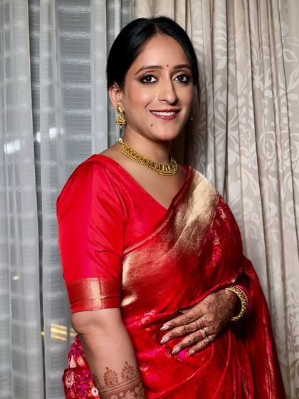 Another angle of this beautiful, classic bridal style. The makeup is focused on clean lines and a radiant finish, ensuring she looks perfect from every view.