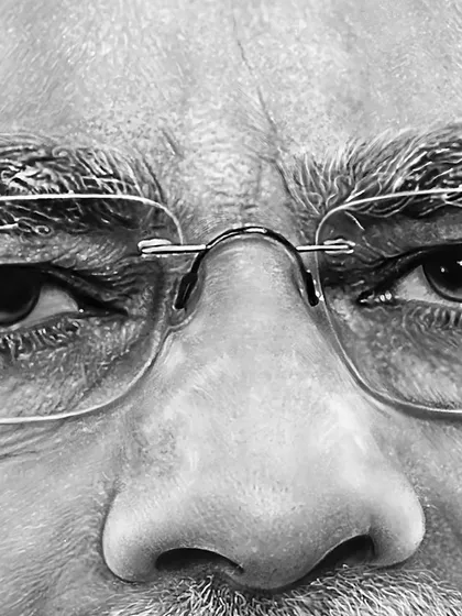A close-up of my portrait of Narendra Modi. This view highlights the extreme detail I work to achieve, from the fine lines around the eyes to the texture of the eyebrows and the subtle reflections in the glasses. This is what hyperrealism is all about for me.
