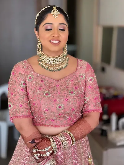 A beautiful close-up of Nilomi's wedding day makeup. The focus is on fresh skin and soft pink tones for a romantic and youthful bridal look.