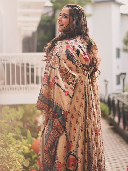 The full look of the printed kaftan, showing how it drapes beautifully. It's a great example of choosing an outfit that flatters your body shape while making a unique style statement.
