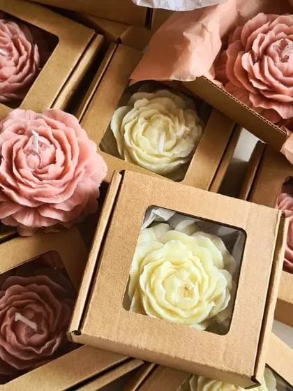 We can create our peony candles in different colors to match your theme. Here are some in shades of pink and white, packed in window boxes.