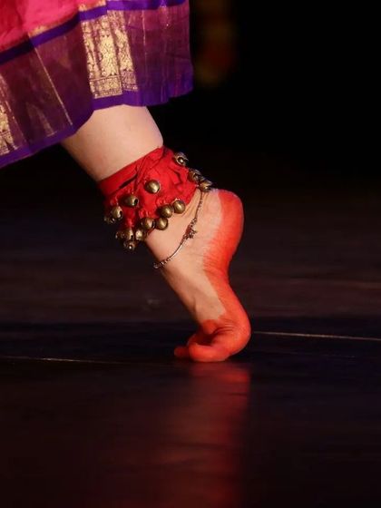 The sound of the ghungroo (salangai) is the heartbeat of a dancer. This close up shows the sacred anklets and the alta-dyed feet, which are central to the Gejjepuje ceremony and every performance.