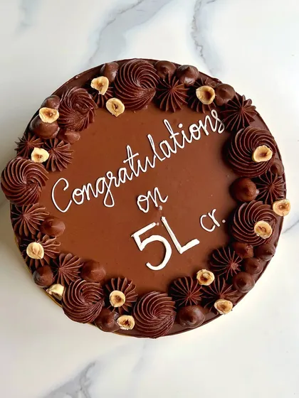 Another look at my popular Hazelnut Praline cake, this time celebrating an even bigger milestone. The combination of chocolate and hazelnut is simply irresistible.