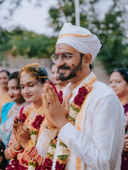 The couple in prayer, surrounded by their loved ones during their traditional wedding ceremony.