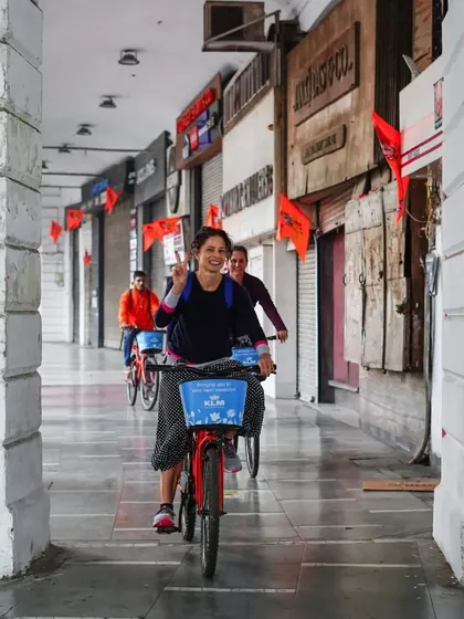 The joy of cycling through the corridors of Connaught Place. This rider's smile says it all.