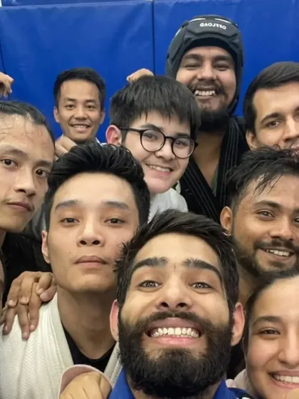 A close-up group selfie showing the intensity and joy of our training community.
