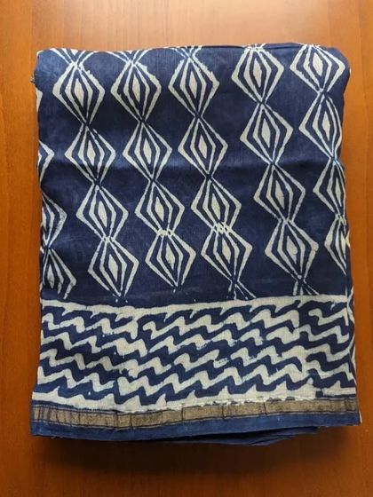 Another stunning indigo handblock print. The diamond and chevron patterns give this silk cotton saree a bold and graphic look.