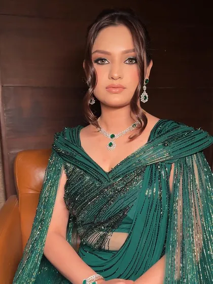 This look was pure Hollywood glamour for an Indian wedding event. I created a soft green shimmer on the eyes to complement the stunning emerald gown, paired with a defined liner and a nude lip to keep the look balanced and sophisticated.