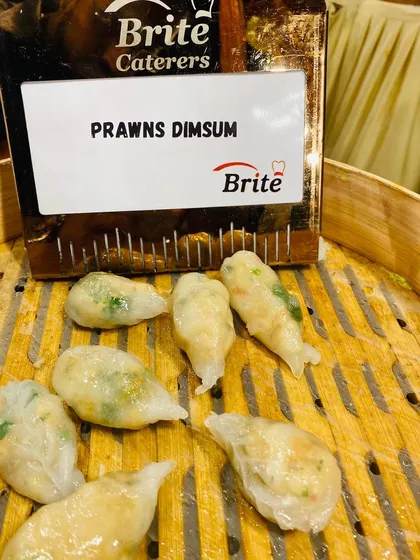 A close-up of the delicate Prawns Dimsum, showcasing the translucent wrapper and fresh filling.