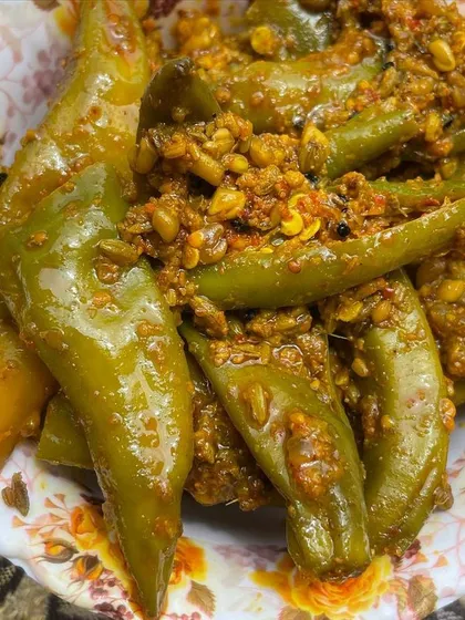 For those who love a spicy kick, my Bharwa Mirchi is a must-try. These are large green chillies stuffed with a flavourful masala mix, pickled in oil to preserve their taste and texture.