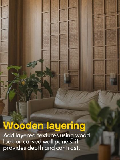 Layered textures are key to a warm, inviting space. Here, carved wooden wall panels provide depth and contrast, creating a sophisticated backdrop that feels both modern and timeless.