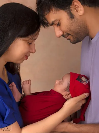 The first family embrace. This intimate portrait captures the overwhelming love and connection as three become one.