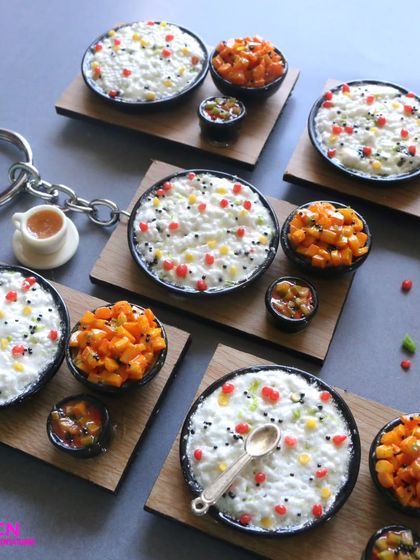 A collection of curd rice miniatures, some as keychains and others as standalone pieces.