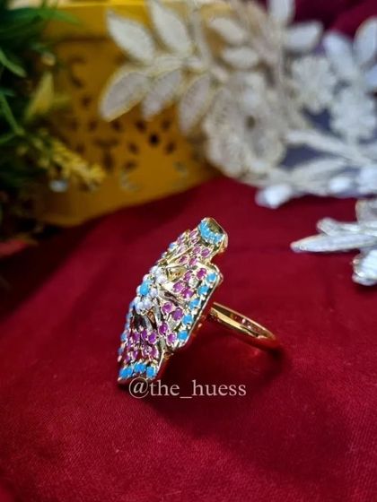 A side view of the 'Anokhi' ring, showing its impressive size and detailed craftsmanship.