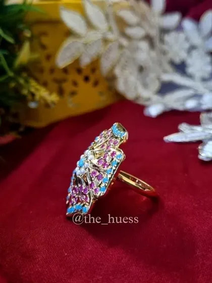 A side view of the 'Anokhi' ring, showing its impressive size and detailed craftsmanship.