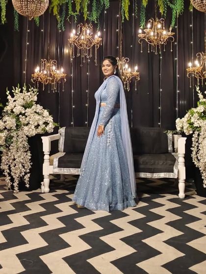 A full view of this stunning powder blue sequin lehenga, custom-stitched for a sangeet night. The way it catches the light is just magical, and the full-sleeve blouse adds a touch of modern elegance.