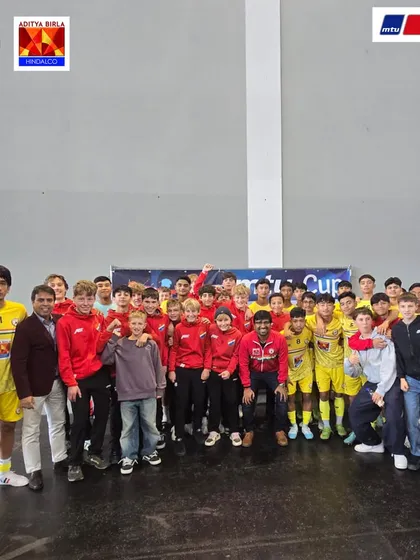 A moment of camaraderie between our team and another youth team at the MTU Cup. Football is a universal language that connects people across cultures.