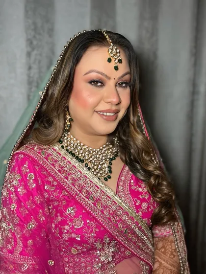 This bride is glowing with happiness. The makeup is designed to look flawless from every angle, ensuring she feels confident and beautiful throughout her wedding.