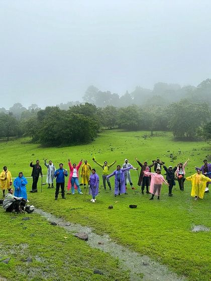 The Sharavathi batch of July 6th & 7th, posing in a wide green meadow, full of energy.