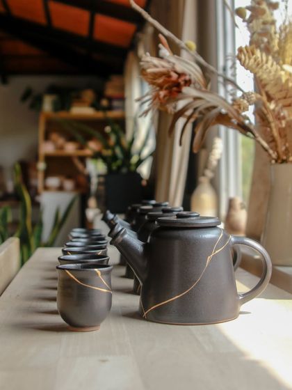 This lineup of teapots and cups represents my dedication to the craft. Each piece is a step forward in my journey to consistently create beautiful, functional teapots.