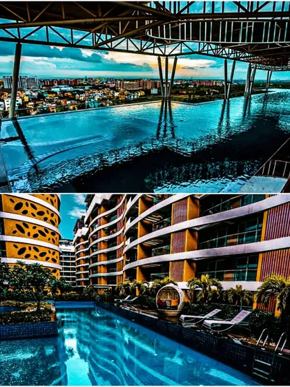 A closer look at the pools at Palm Bellagio. The rooftop infinity pool offers panoramic city views, while the ground-level pool is nestled within the building's curves, creating two distinct recreational experiences.