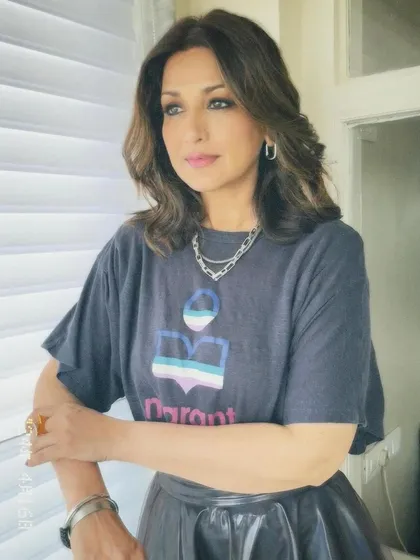 A more contemplative portrait of Sonali Bendre. The makeup is clean and sophisticated, with a focus on flawless skin and defined eyes.