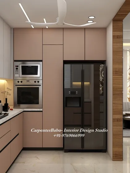 Another view of the dusty rose kitchen, showing the seamless integration of the refrigerator and other appliances.