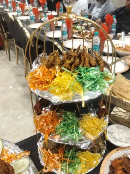 I don't just serve food, I create a feast for the eyes. My multi-tiered golden stands make the starters look as amazing as they taste.