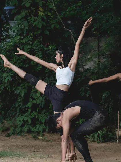 A beautiful contemporary dance formation with a supported leg extension. This photo demonstrates the trust and teamwork we build within our dance company to execute complex and artistic choreography.