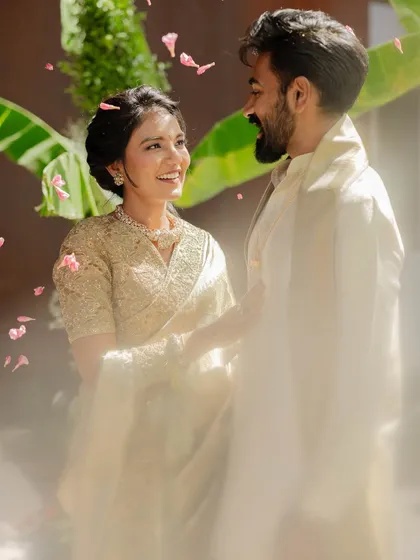 A candid, joyful moment captured beautifully. The soft, elegant makeup ensures the client looks flawless and feels confident even in unposed, happy moments.