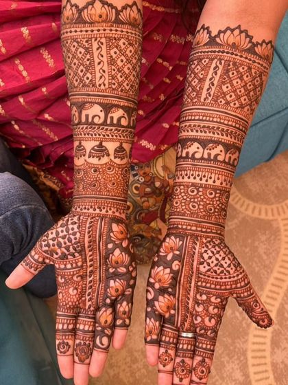 A beautiful and intricate design for the groom's maid, featuring traditional elephant and jhumka motifs.