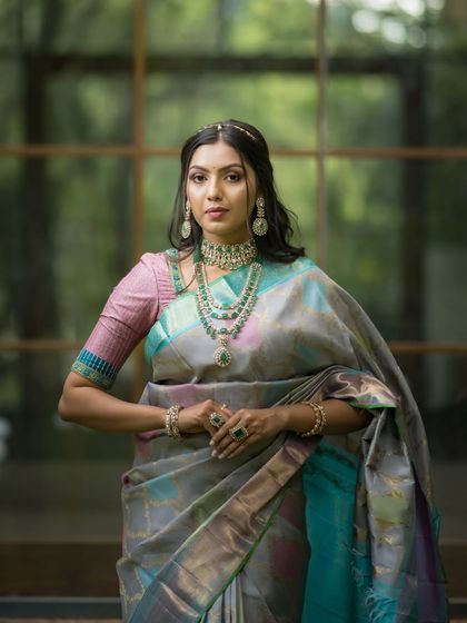 Another powerful and poised portrait, showcasing the modern yet traditional appeal of this designer saree.