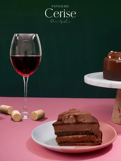 A glass of red wine is another perfect companion for the Midnight Sun. The wine's tannins and fruit notes complement the deep chocolate, elevating the entire experience.