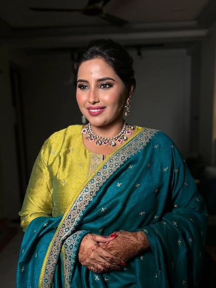 A close-up of this elegant makeup look, showing the flawless skin finish and the beautifully shaped brows that frame her face.
