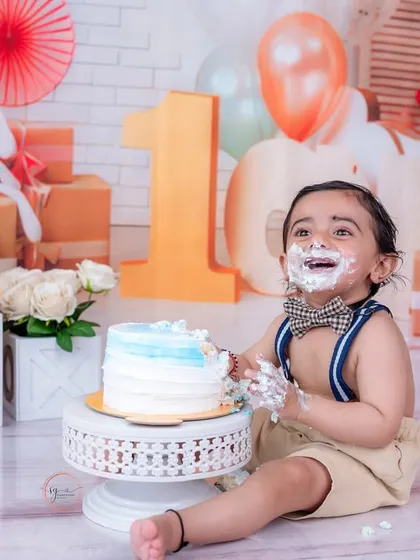 Looking up with a frosting-covered smile, this shot is a perfect example of the joyful, candid moments I aim to capture.