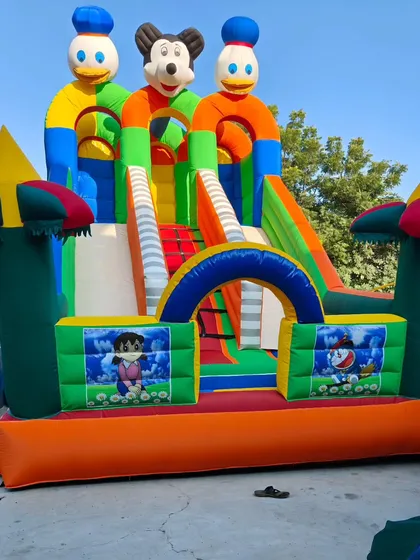 This 3-slider bouncy features Dora and Donald Duck characters. The mix of green, orange, and blue makes it stand out.