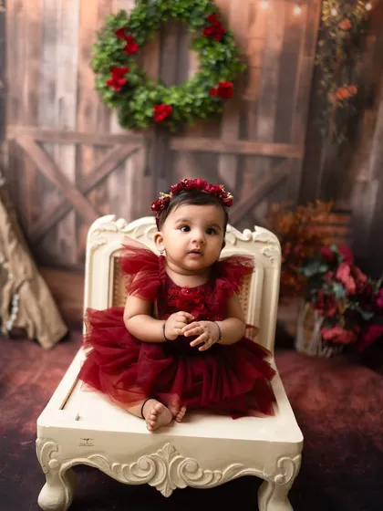 A sweet and simple portrait from the rustic red milestone shoot. Her curious expression is beautifully captured in this charming setup.