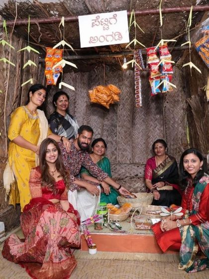 A fun family photo at the 'Pettige Angadi' booth. These interactive stalls become the heart of the party, buzzing with activity and happy conversations.