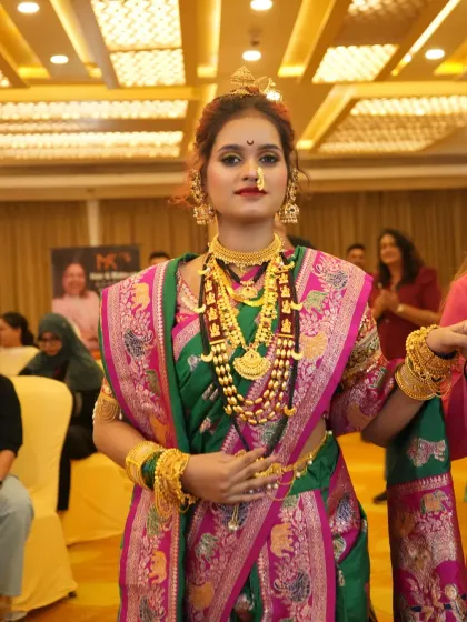 A candid moment from the seminar, the bride looking radiant and happy with her final look.