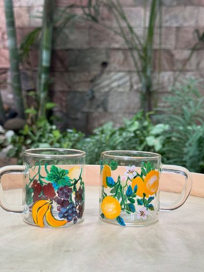 A final look at the upcycled cups, featuring banana and grape designs. You can also bring your old glassware to our studios for a custom makeover.