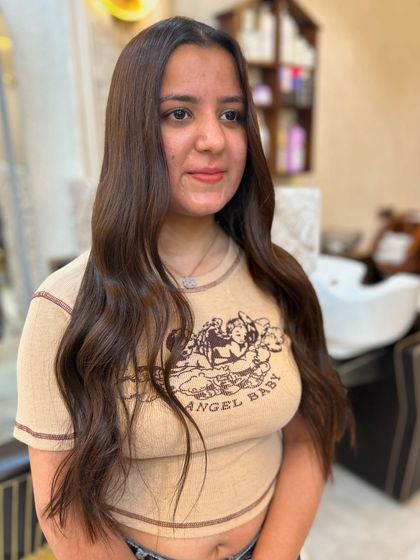 A lovely portrait of our client enjoying her new olive ashy brown hair colour.