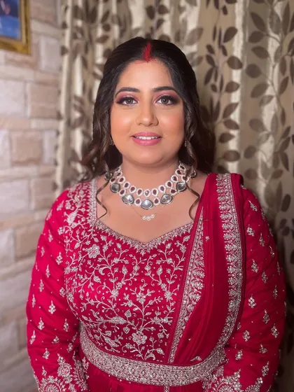 A smiling portrait of the bride, looking ready to celebrate.