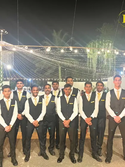 Our team of bartenders, looking sharp in their uniforms and ready to create an unforgettable event at Colaba Agiary. We pride ourselves on our professional appearance and service.